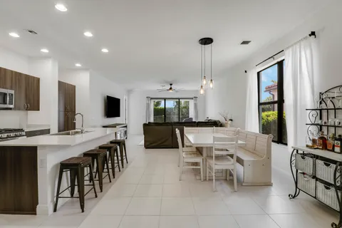 a view of a dining room and livingroom with furniture