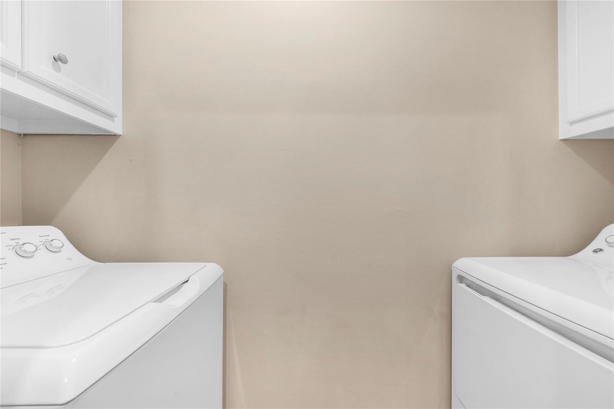 8731 Bryam Houston, TX 77061 - Photo 12 of 19 a utility room with dryer and washer