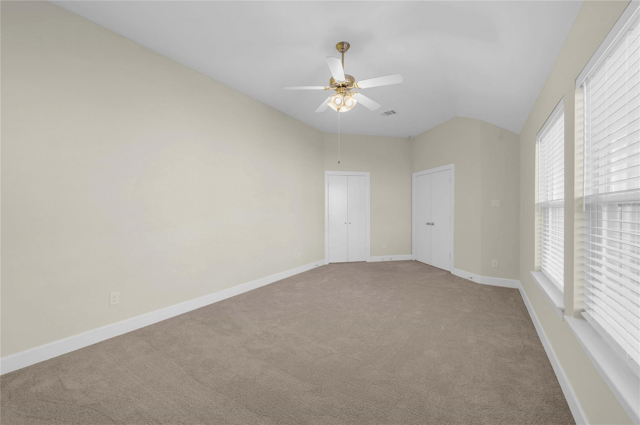 8731 Bryam Houston, TX 77061 - Photo 14 of 19 an empty room with a window and a ceiling fan