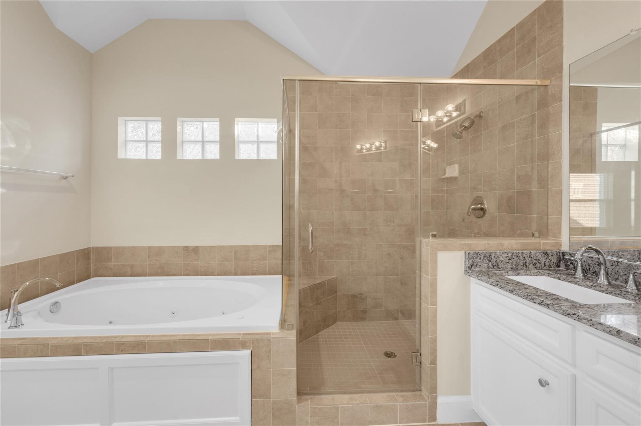 8731 Bryam Houston, TX 77061 - Photo 16 of 19 a bathroom with a granite countertop bathtub shower sink and mirror