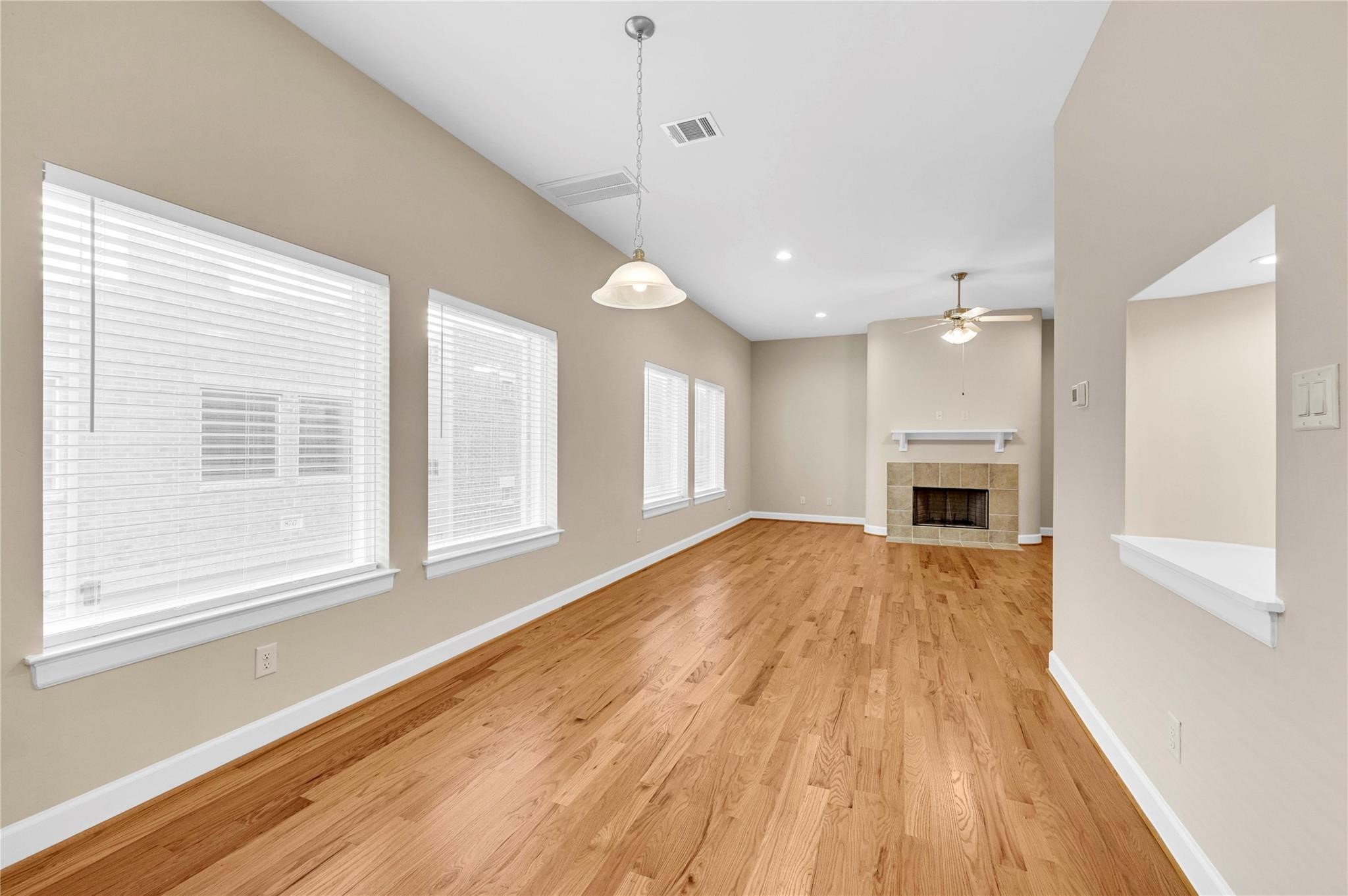 8731 Bryam Houston, TX 77061 - Photo 6 of 19 a view of an empty room with wooden floor and a window