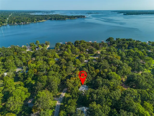 a partial view of a houses with a lake