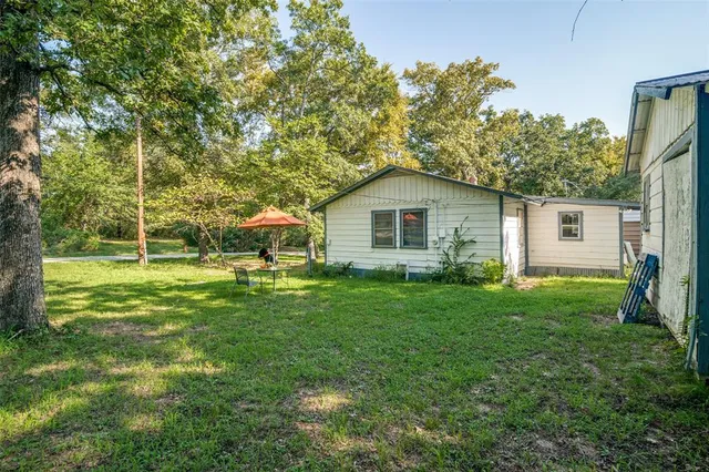 a house view with a garden space