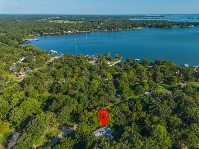 a view of a lake with houses in the back