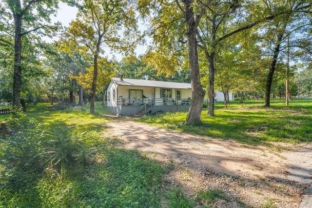 a view of a house with a big yard