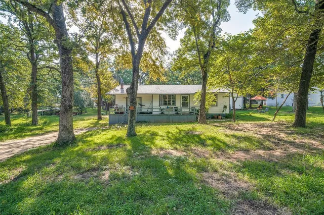 a view of a house with a big yard