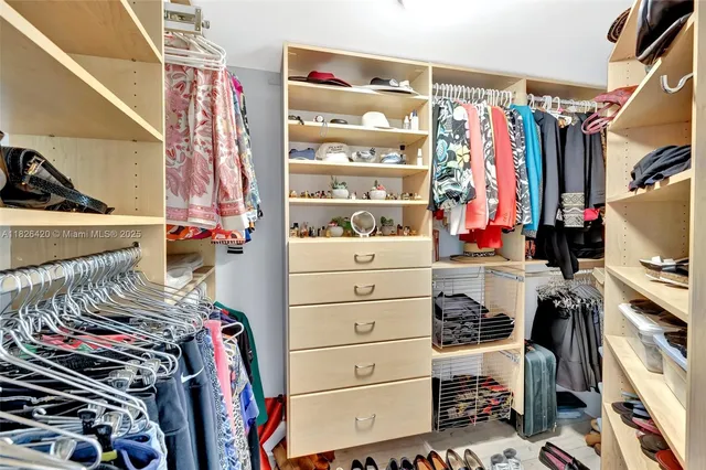 a bedroom with a bed and a lamp on table