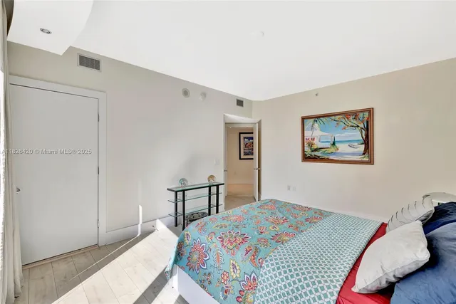 a large kitchen with stainless steel appliances kitchen island a large counter top