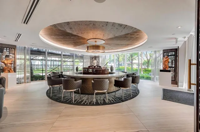 a view of a dining room with furniture and window