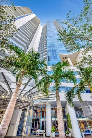 a large kitchen with kitchen island a large window