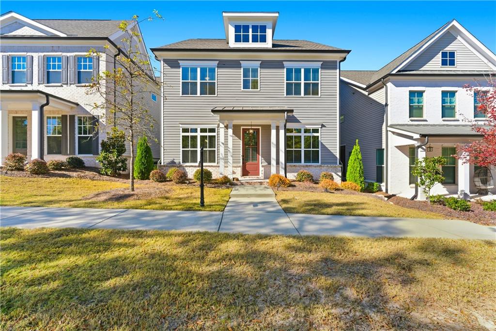 a view of a brick house with a swimming pool