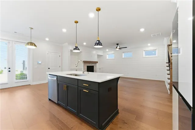 a view of a kitchen with a sink and a fireplace