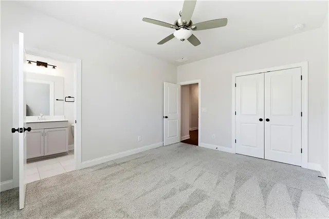 a bathroom with a sink a mirror toilet and bathtub