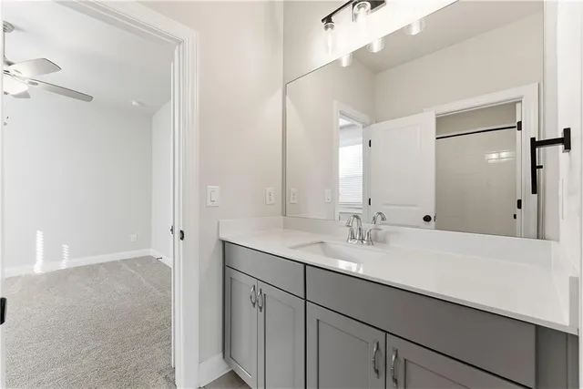 an empty room with fan and a ceiling fan