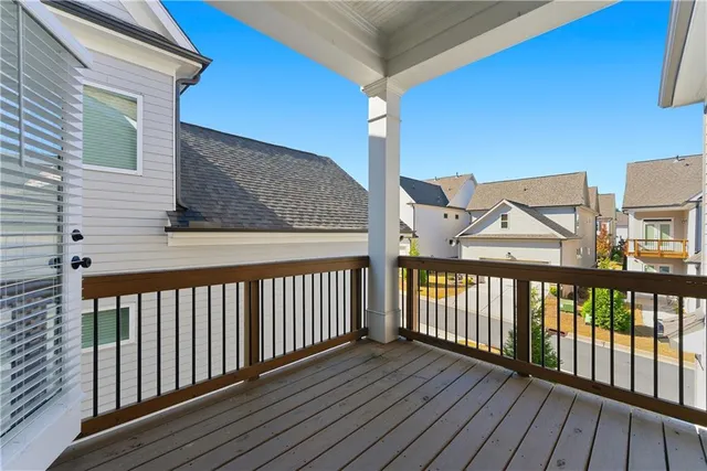 a bathroom with a granite countertop bathtub sink vanity and mirror