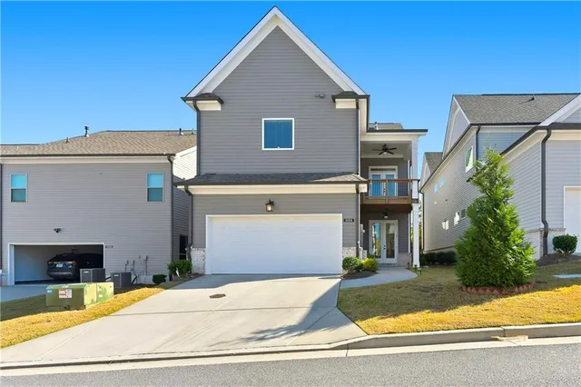 a view of house with backyard and garden
