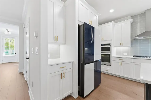 a large kitchen with stainless steel appliances kitchen island a large island in the center