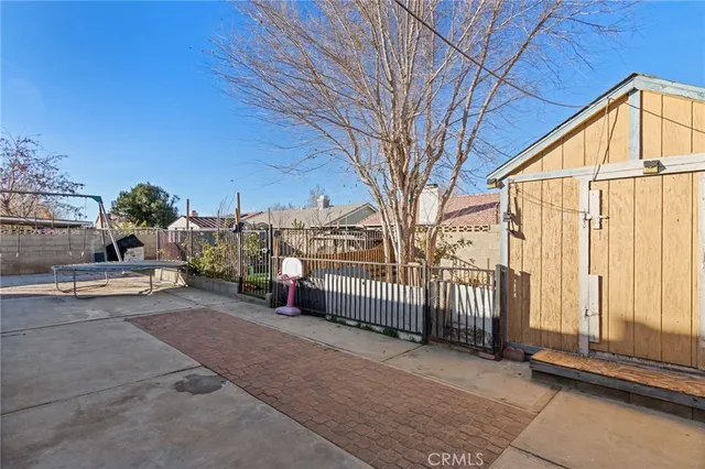 a view of a house with a snow in the yard
