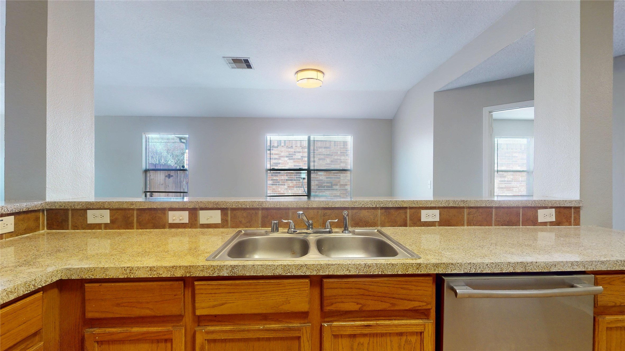 6007 Baldwin Elm Street Richmond, TX 77407 - Photo 13 of 45 a kitchen with granite countertop a sink and a granite counter tops