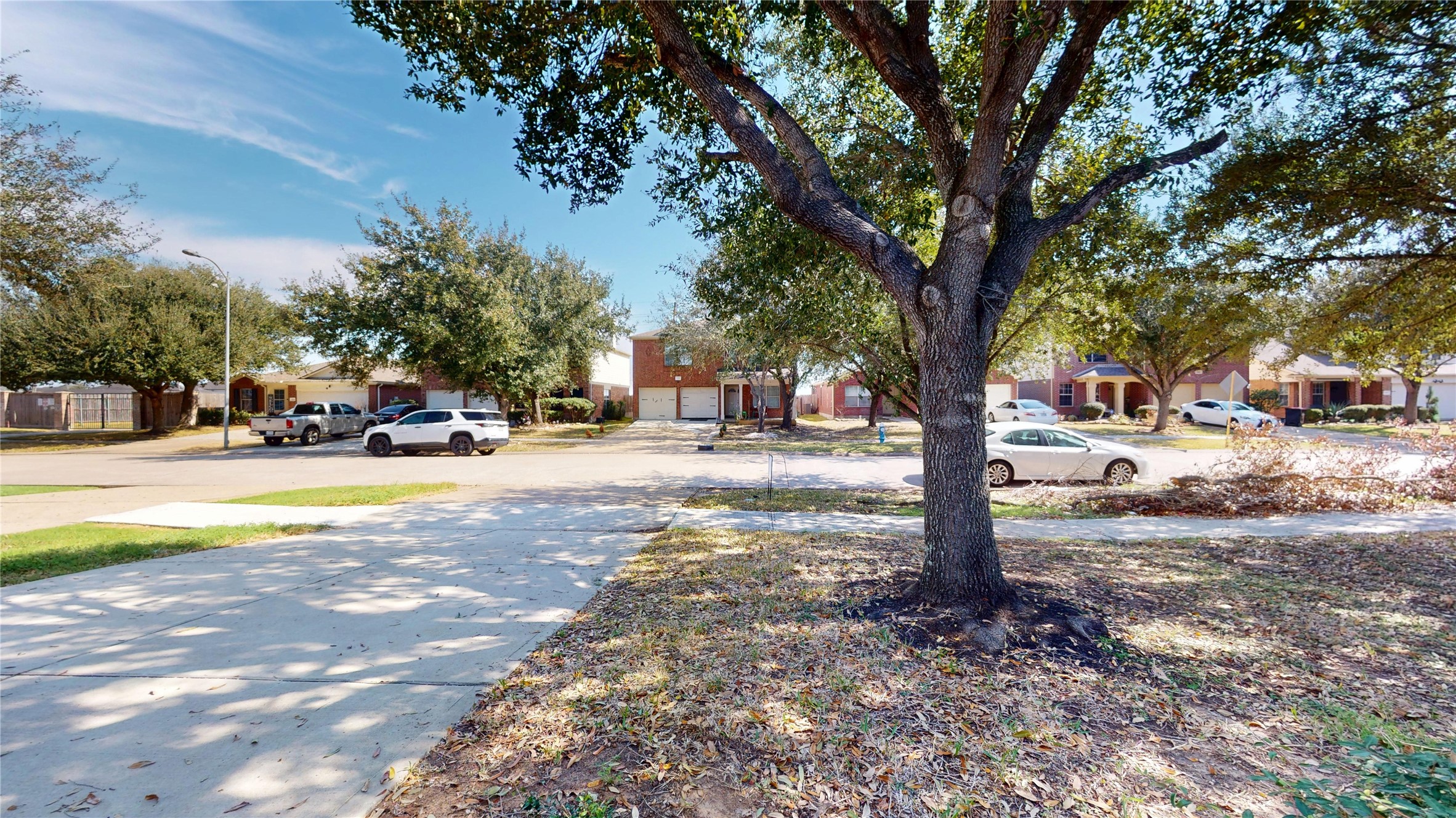 6007 Baldwin Elm Street Richmond, TX 77407 - Photo 2 of 45 a view of street with parked cars