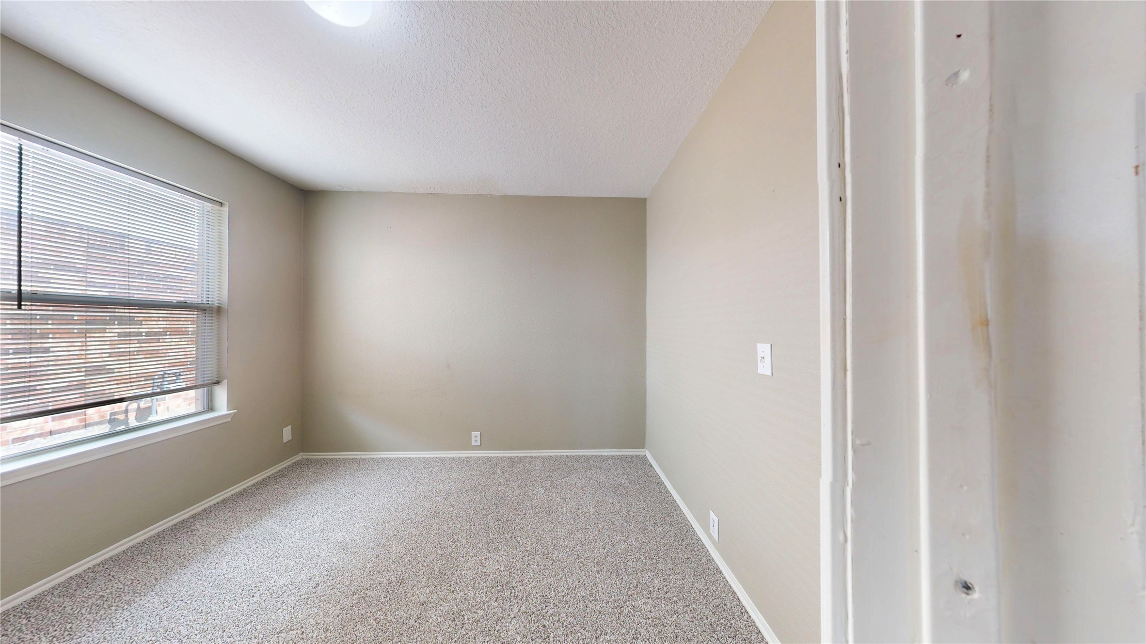 6007 Baldwin Elm Street Richmond, TX 77407 - Photo 28 of 45 a view of an empty room with a window