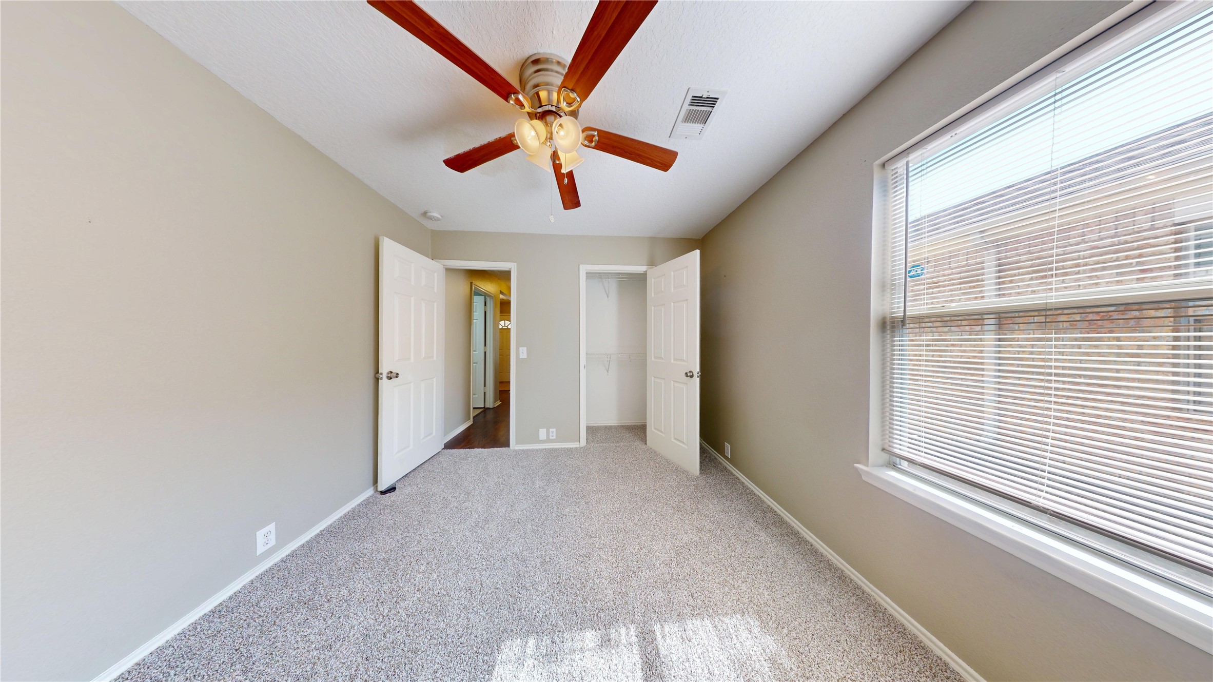 6007 Baldwin Elm Street Richmond, TX 77407 - Photo 33 of 45 a view of a livingroom with a ceiling fan and window