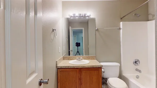 a bathroom with a shower and a toilet