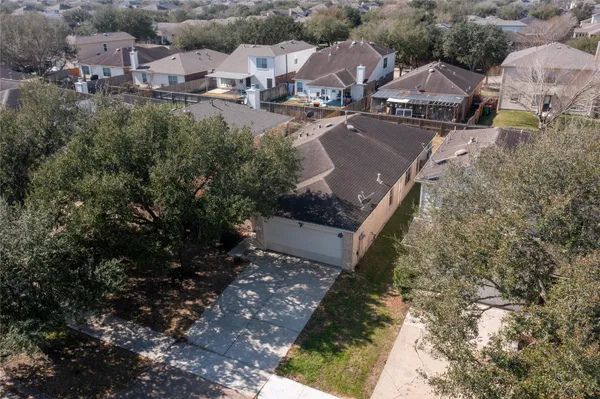 an aerial view of a house with swimming pool