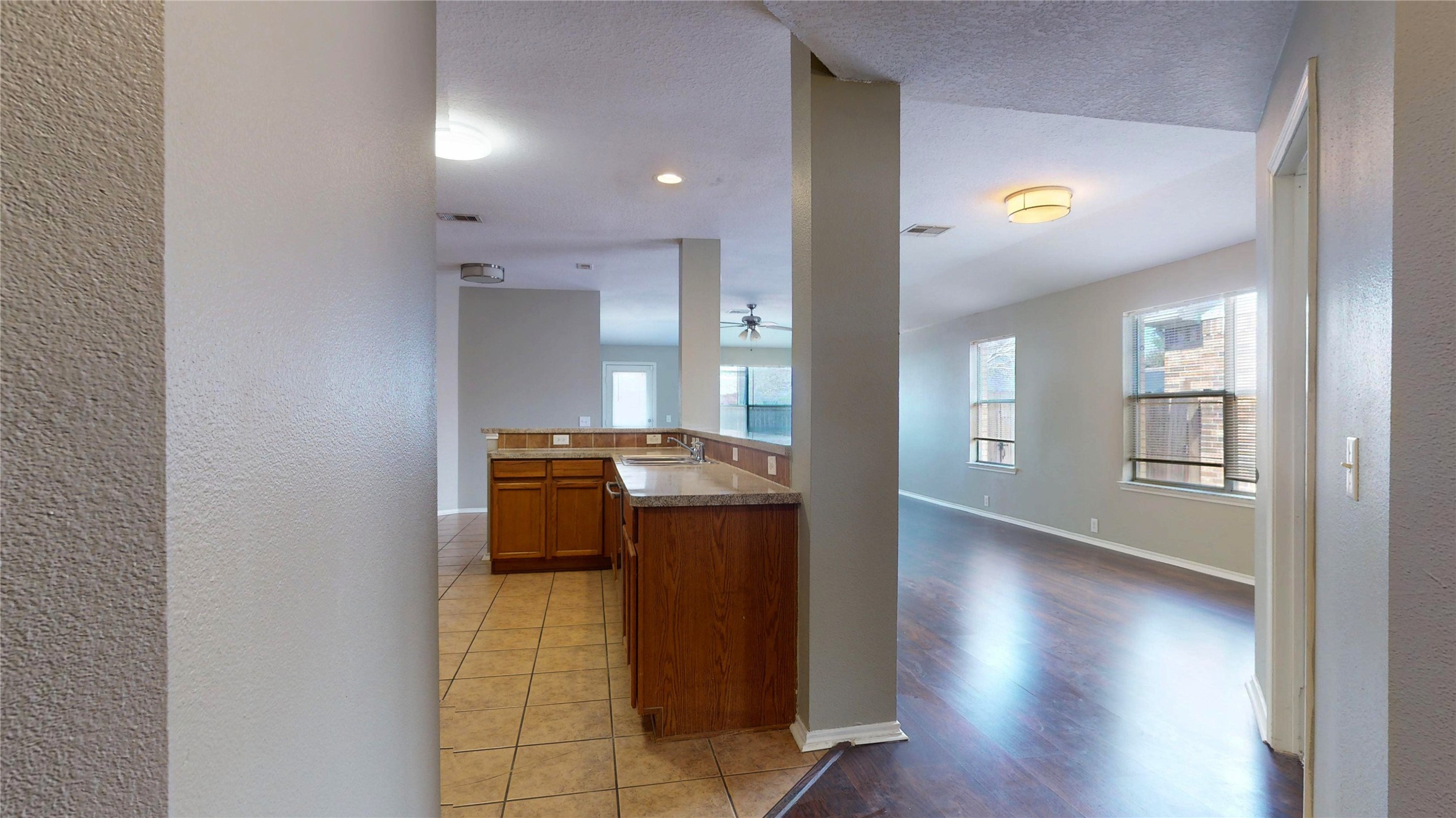 6007 Baldwin Elm Street Richmond, TX 77407 - Photo 6 of 45 a view of kitchen with windows and refrigerator