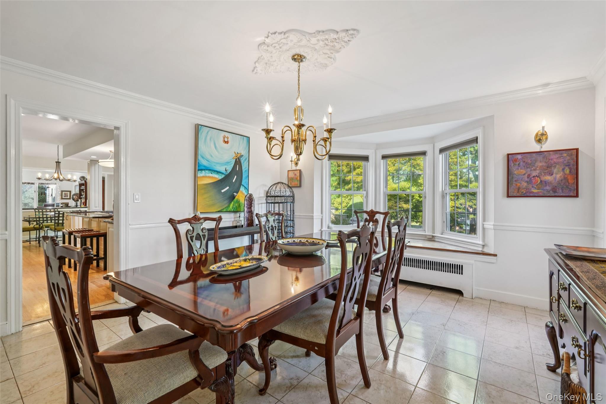 8 Abbey Road West Nyack, NY 10994 - Photo 14 of 38 a dining room with furniture a chandelier and wooden floor