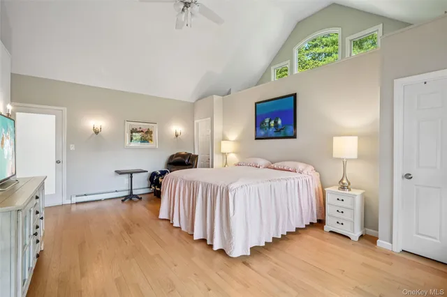 a bedroom with a bed and a night stand