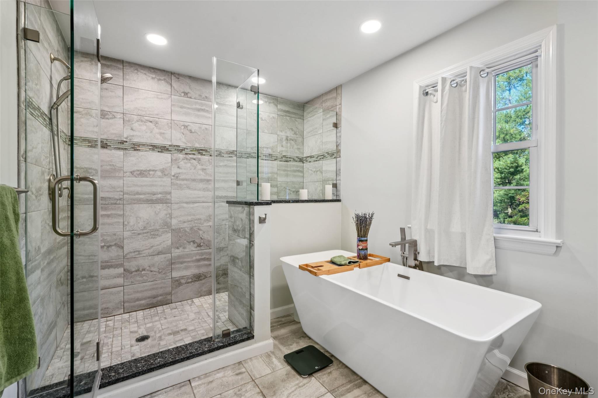 8 Abbey Road West Nyack, NY 10994 - Photo 23 of 38 a bathroom with a tub and a shower