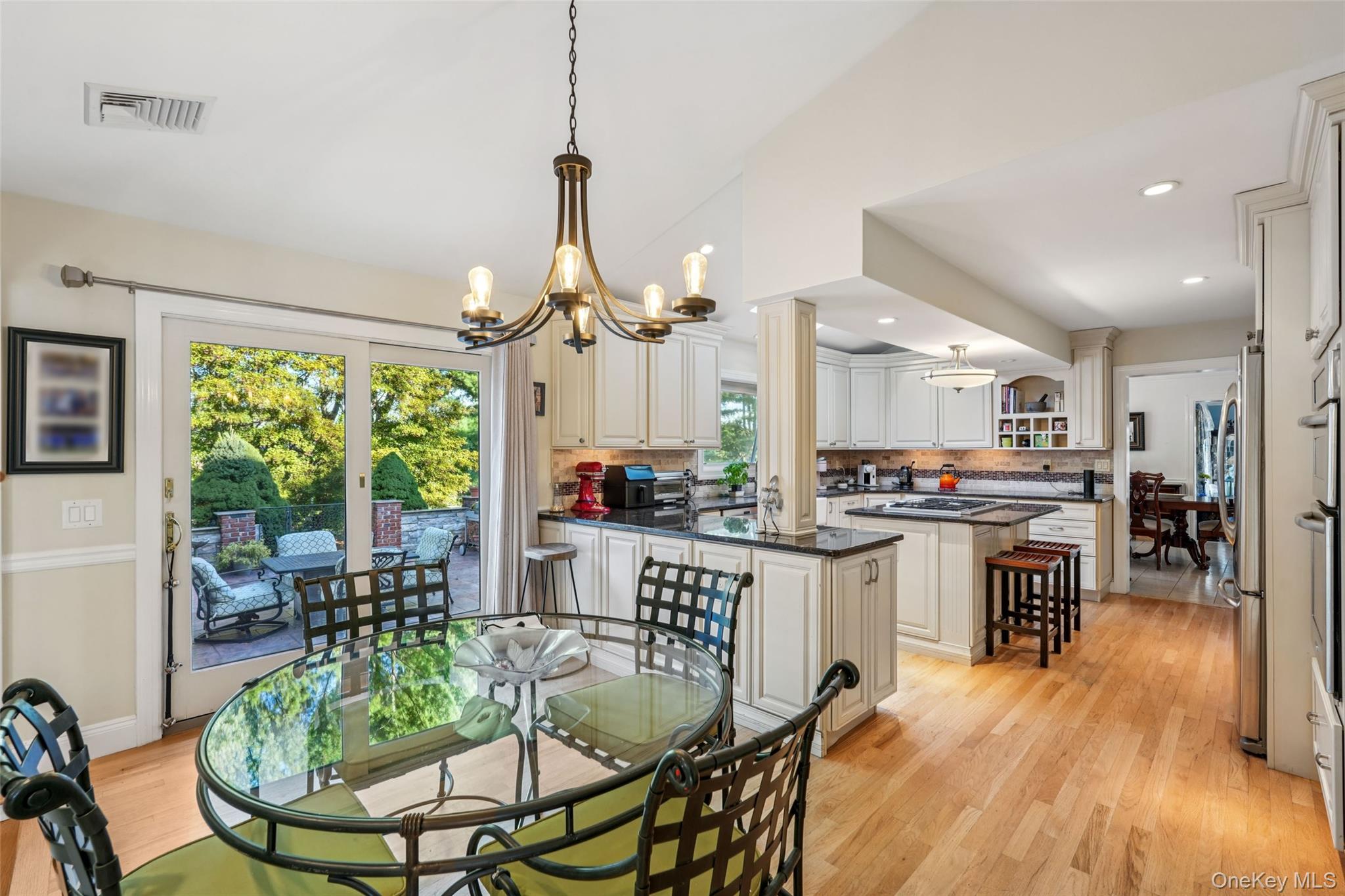 8 Abbey Road West Nyack, NY 10994 - Photo 4 of 38 a kitchen with a table chairs stove and cabinets