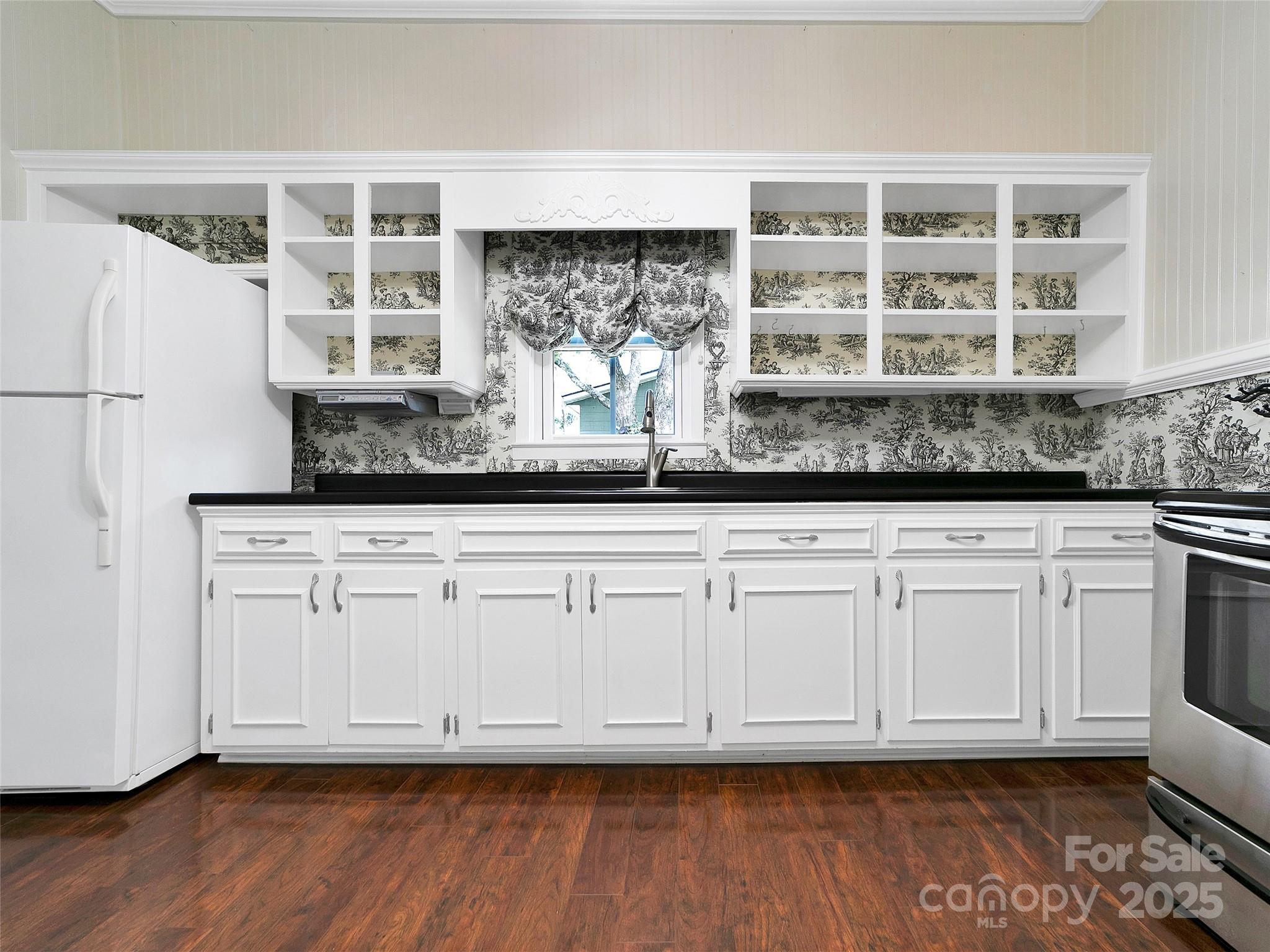 363 North Country Club Road Brevard, NC 28712 - Photo 14 of 42 a kitchen with granite countertop white cabinets and wooden floor