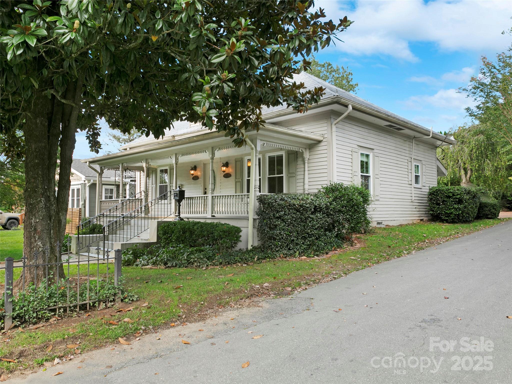 363 North Country Club Road Brevard, NC 28712 - Photo 2 of 42 a front view of a house with garden