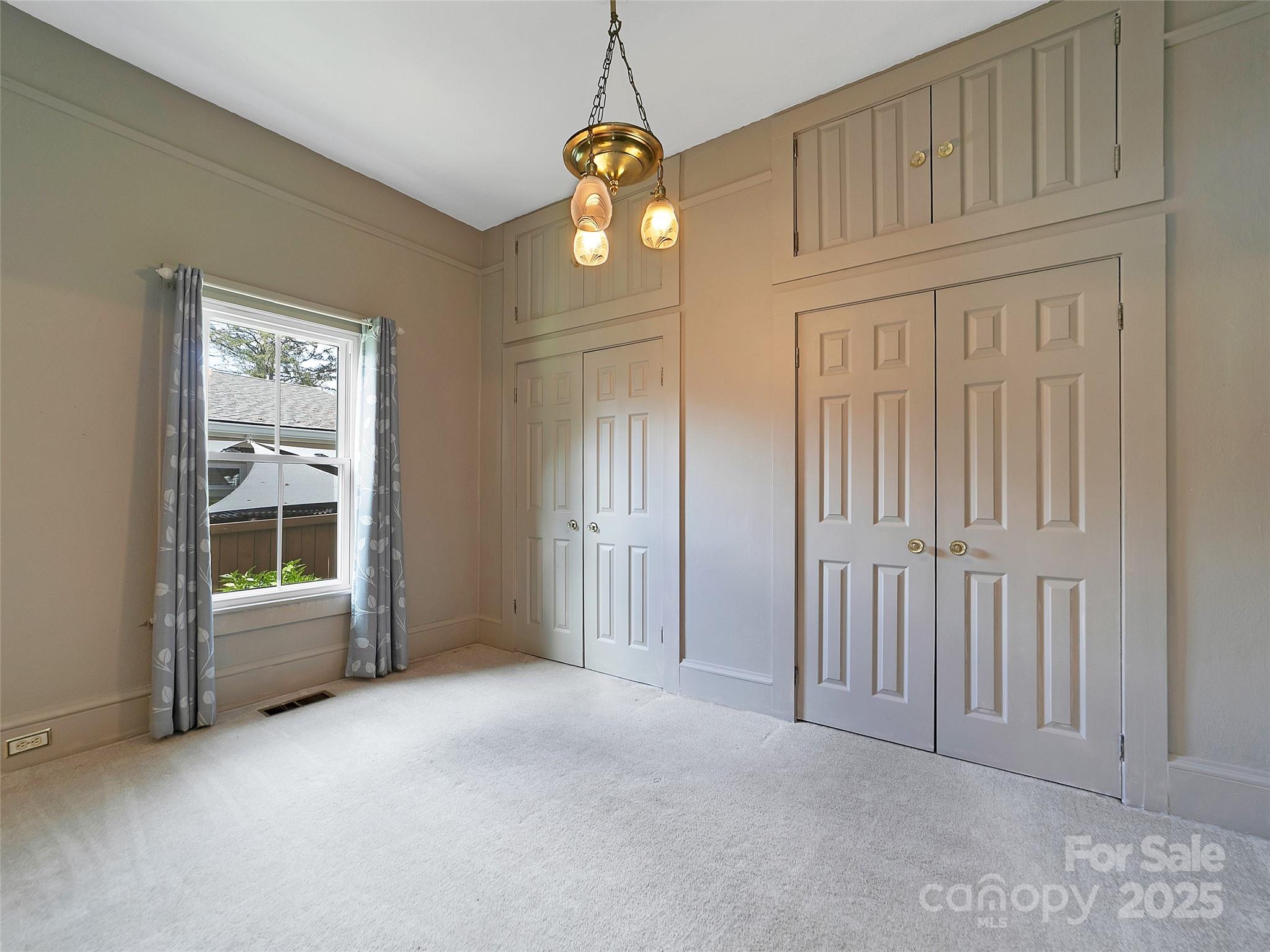 363 North Country Club Road Brevard, NC 28712 - Photo 23 of 42 an empty room with windows and entrance