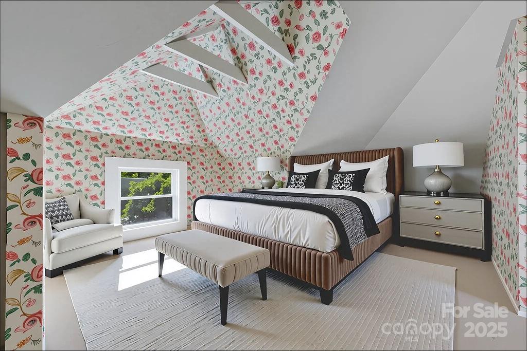 363 North Country Club Road Brevard, NC 28712 - Photo 32 of 42 a spacious bedroom with a bed couch and a window