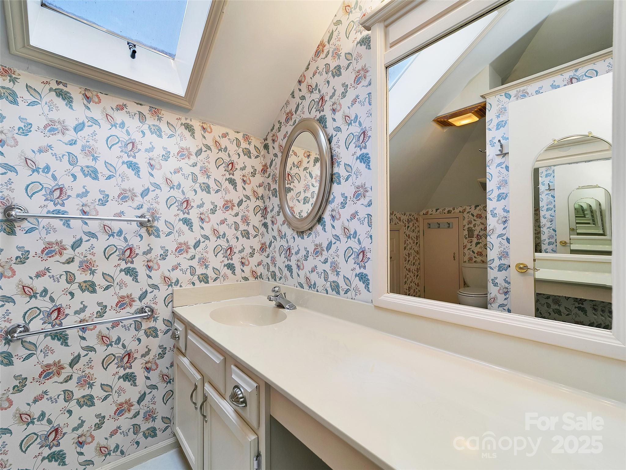 363 North Country Club Road Brevard, NC 28712 - Photo 35 of 42 a bathroom with a sink and a mirror