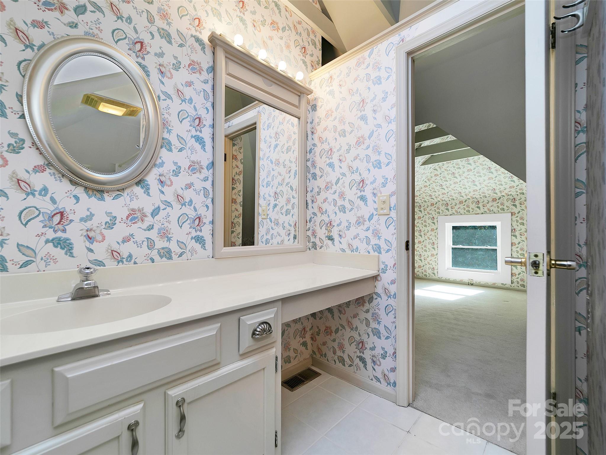 363 North Country Club Road Brevard, NC 28712 - Photo 36 of 42 a bathroom with a sink and a mirror