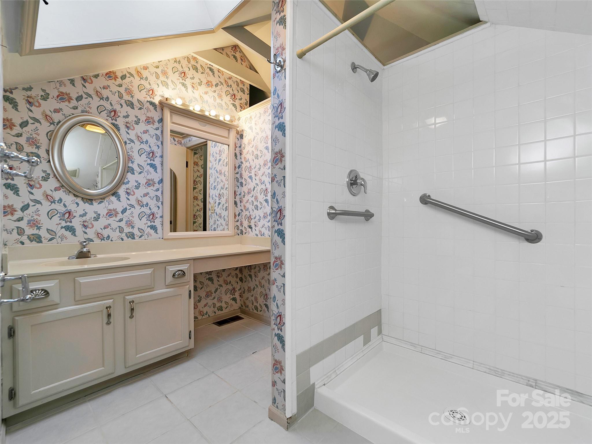 363 North Country Club Road Brevard, NC 28712 - Photo 37 of 42 a bathroom with a sink and a mirror