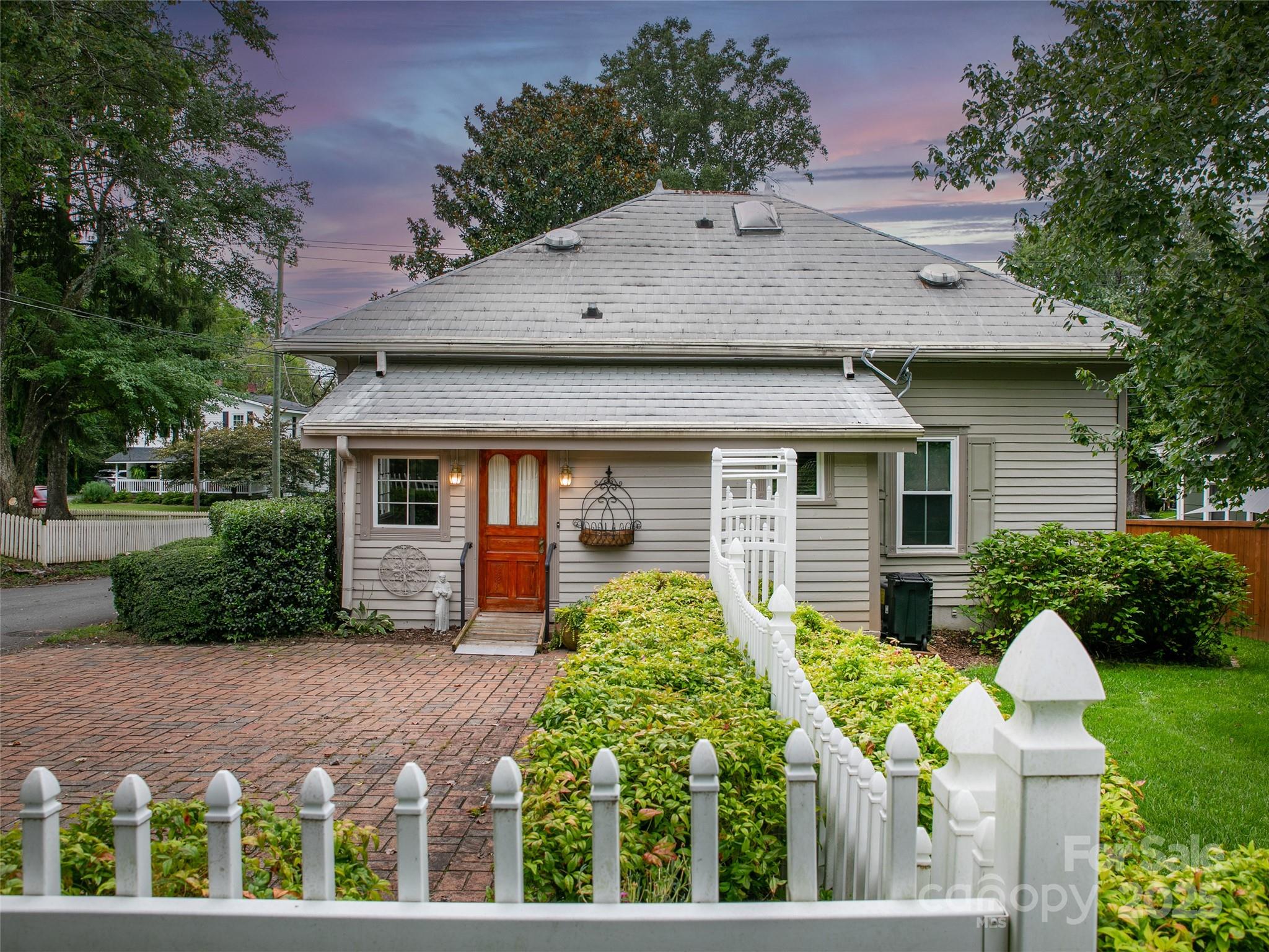 363 North Country Club Road Brevard, NC 28712 - Photo 41 of 42 a front view of a house with garden