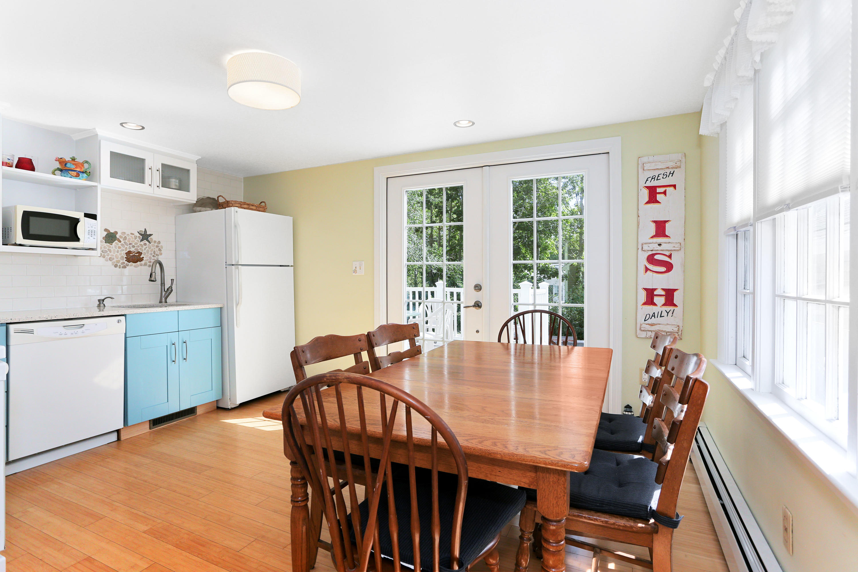 93 Brooks Road Harwich Port, MA 02646 - Photo 10 of 35 a view of a dining room with furniture window and outside view