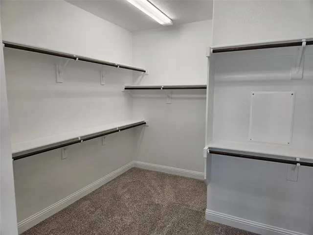 a view of an empty walk in closet