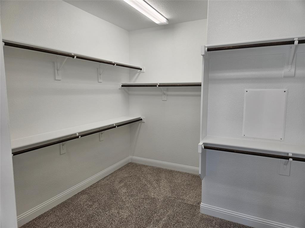 1529 Enloe Road Howe, TX 75459 - Photo 19 of 30 a view of an empty walk in closet
