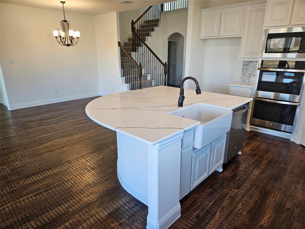 1529 Enloe Road Howe, TX 75459 - Photo 4 of 30 a kitchen with sink and kitchen island