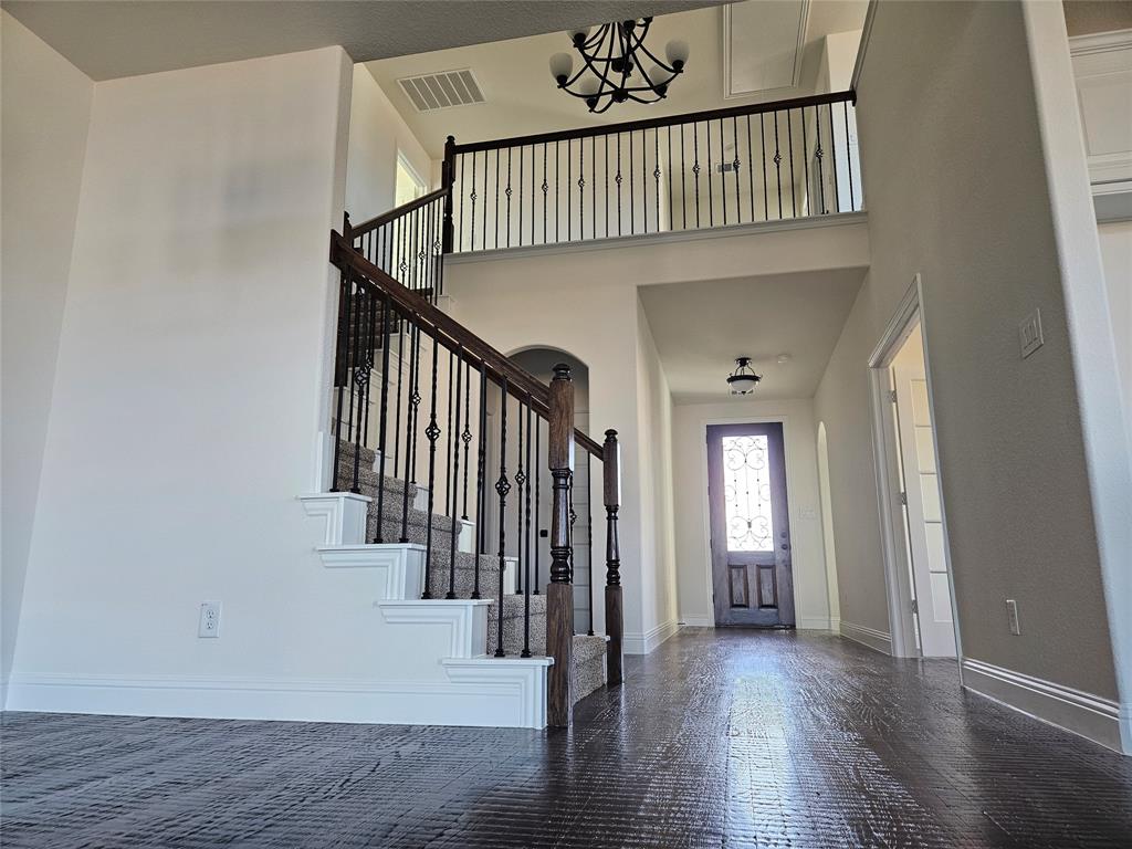 1529 Enloe Road Howe, TX 75459 - Photo 9 of 30 a view of entryway with wooden floor and stairs