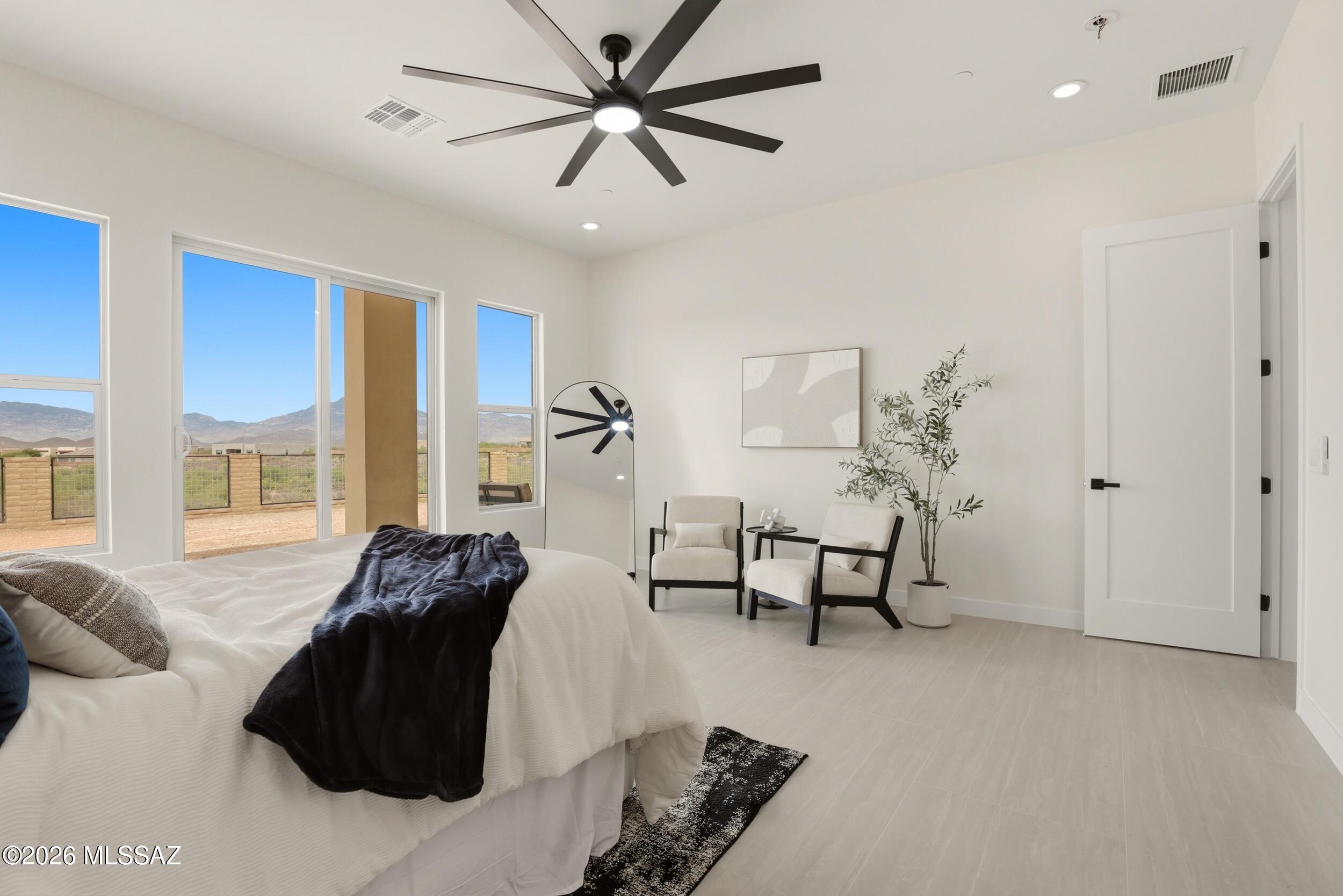 14527 East Sands Ranch Road Vail, AZ 85641 - Photo 22 of 48 a bedroom with a bed and a chandelier