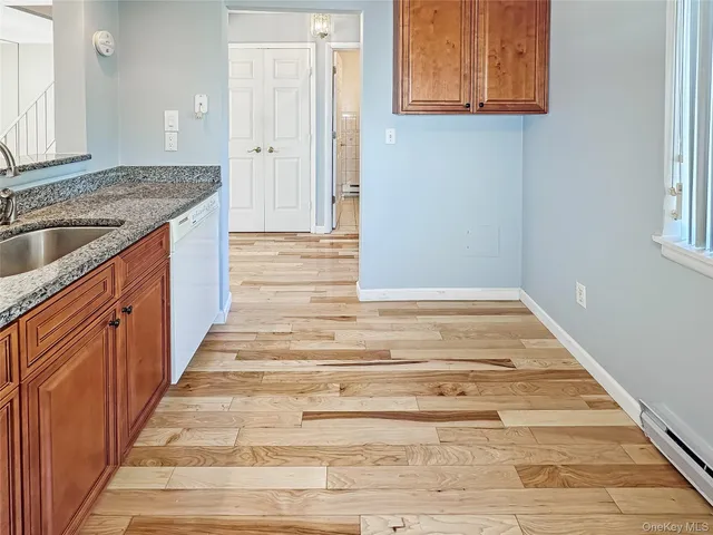 a view of a kitchen sink and dishwasher