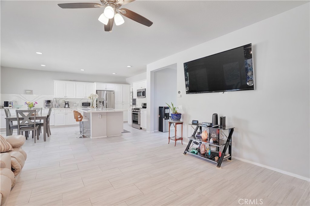 12179 Dewar Drive Riverside, CA 92505 - Photo 14 of 53 a view of a livingroom with furniture and a flat screen tv