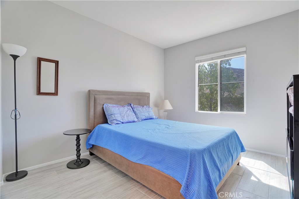 12179 Dewar Drive Riverside, CA 92505 - Photo 21 of 53 a bedroom with a bed and window